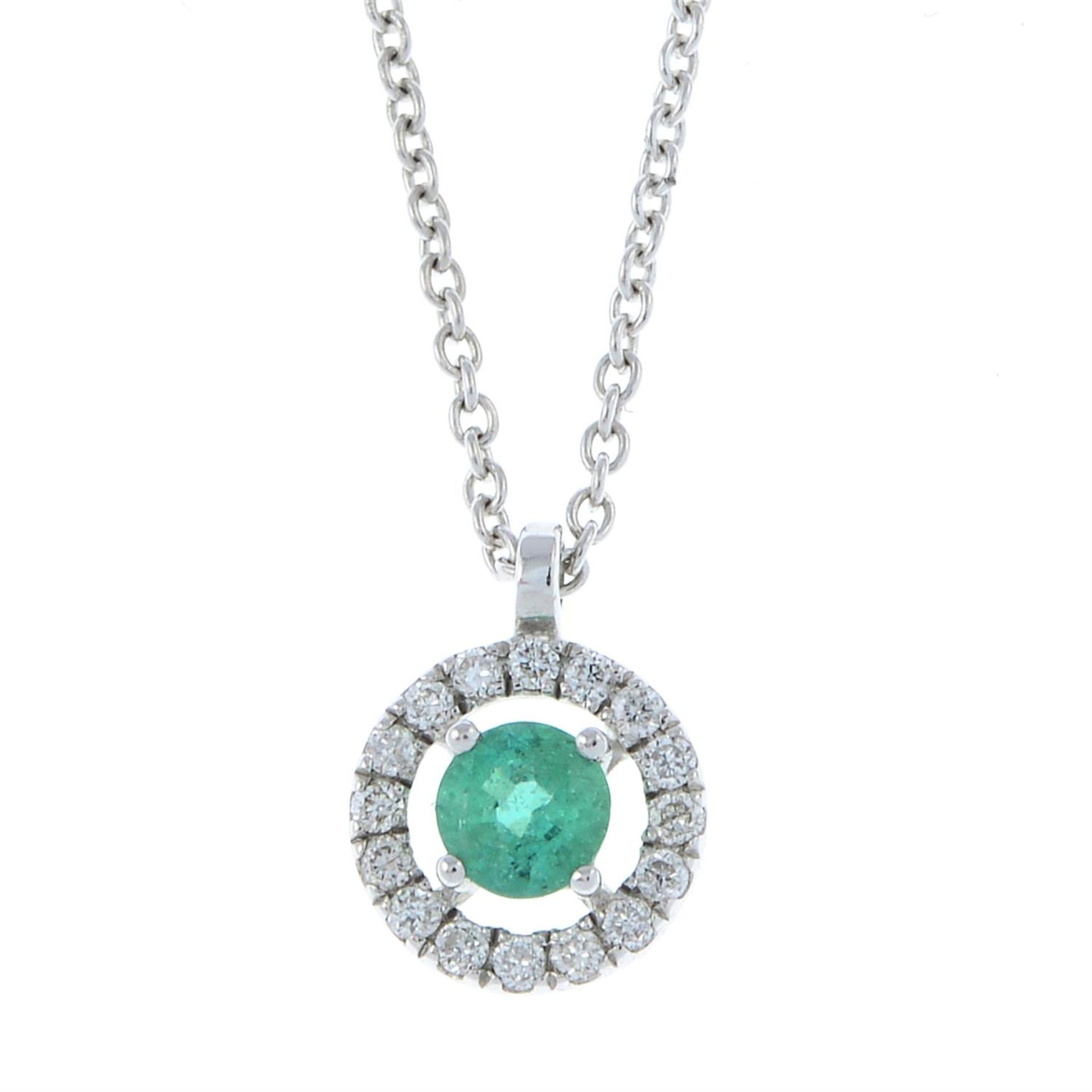 An emerald and diamond pendant, with trace-link chain.