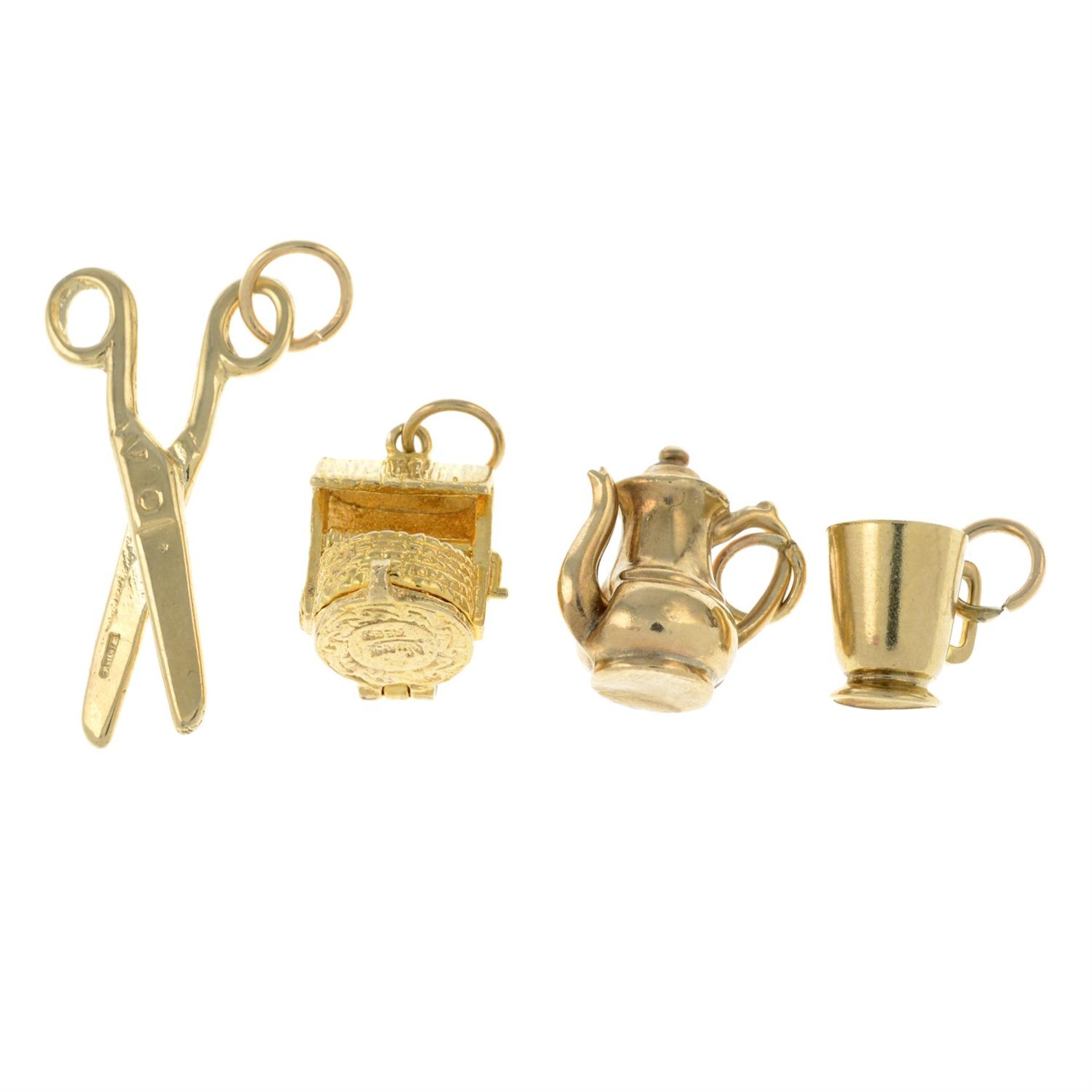 Four 9ct gold charms.