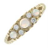A 9ct gold opal three-stone ring, with brilliant-cut diamond spacers.
