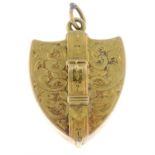 An early 20th century shield-shape locket, with buckle motif.