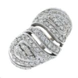 A brilliant-cut diamond openwork dress ring.