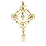 An early 20th century 9ct gold amethyst and split pearl pendant, suspending an imitation pearl drop.