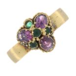 An 18ct gold Victorian band ring, with later added 19th century garnet and green paste cluster.