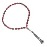 A carnelian bead rosary with tassel.