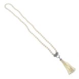 A cultured pearl single-strand necklace, with cubic zirconia leopard finial and removable tassel.