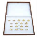 Seventeen display signet rings, with case.