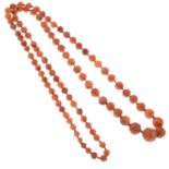 A graduated carnelian bead necklace