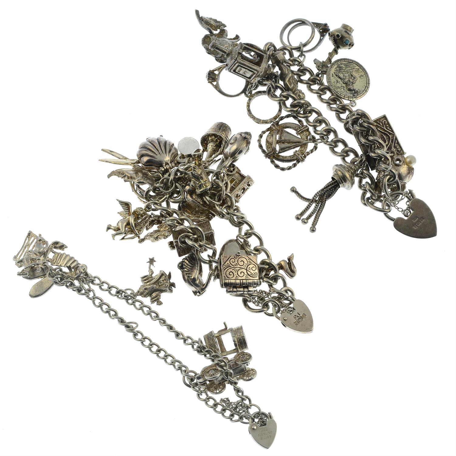 Two silver charm bracelets and a further charm bracelet, with a variety of charms. - Image 2 of 2