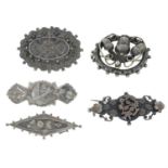 Five Victorian silver floral brooches.