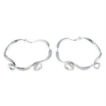 A pair of silver cubic zirconia fancy hoop earrings.