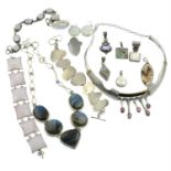 A selection of silver and gem-set white metal jewellery.