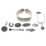A selection of ten item of late 19th century jewellery to include seven brooches a paste pendant