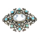 An Arts and Crafts silver moonstone and turquoise floral brooch, by Zoltan White.