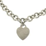A heart-shaped dog tag necklace, by Tiffany & Co.