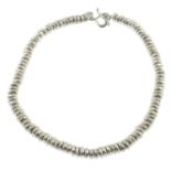 A silver bead necklace, by Dower & Hall.
