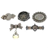 A selection of late 19th and early 20th century silver floral and foliate motif brooches.