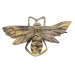 A 19th century horn brooch, carved to depict a wasp.
