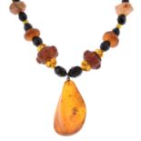 An amber and plastic bead necklace.