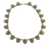 An early 20th century reconstituted lapis lazuli floral necklace.