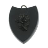 A late Victorian jet mourning locket pendant, with rose motif.