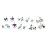 A selection of blue and purple cubic zirconia earrings and pendants.