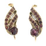 A pair of garnet earrings.