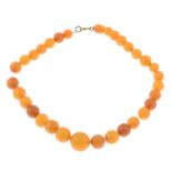 A graduated amber bead single-strand necklace, on wire cord.