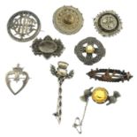 A selection of late 19th to early 20th century silver brooches.