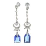 A pair of early 20th century colourless zircon and blue paste earrings.