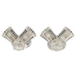 A pair of silver articulated piston cufflinks, by Deakin and Francis.