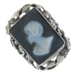 An onyx cameo foliate ring, depicting a woman in profile.