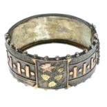 A Victorian silver tri-colour floral hinged bangle.