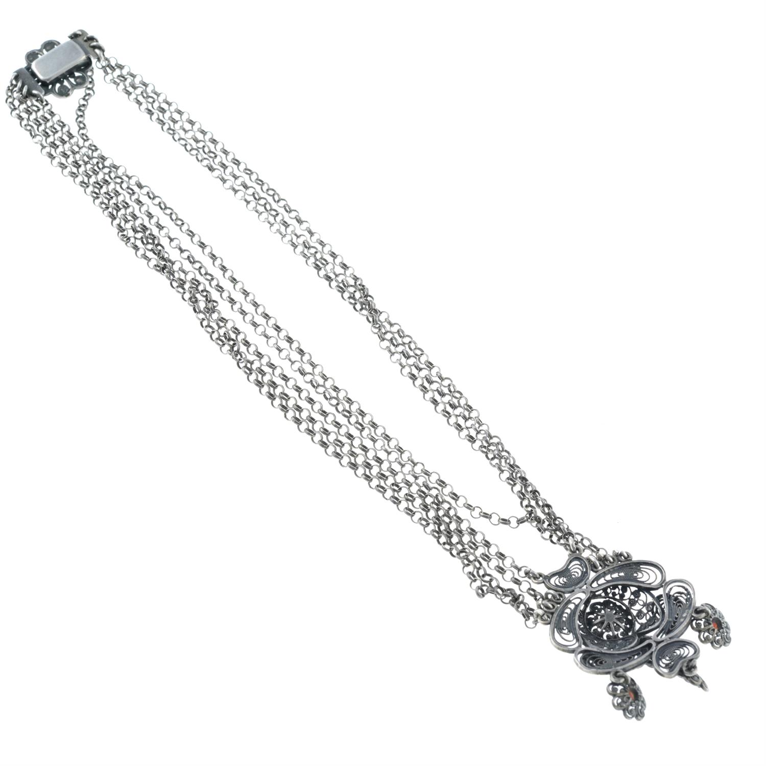 An early 20th century silver garnet floral filigree necklace. - Image 2 of 2