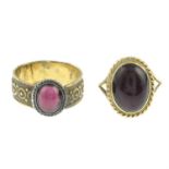 Two garnet cabochon rings.