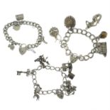 Two silver charm bracelets together with a further charm bracelet with a variety of charms.