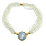 A multi-strand white bead necklace, with a Wedgwood jasperware cameo depicting Diana the huntress.