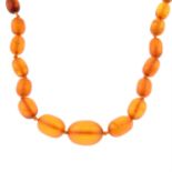 A graduated amber single-strand necklace.