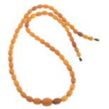 A amber bead single-strand necklace.