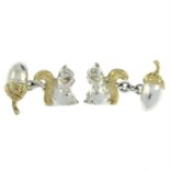 A pair of cufflinks, depicting a squirrel and an acorn, by Links of London.