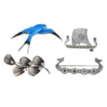 Four silver brooches, including a long boat brooch by Anton Michelson and another by Ola Gorie.