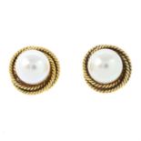 A pair of cultured pearl single-stone stud earrings.