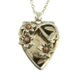 A silver heart-shape openwork pendant, on chain, by Clogau.