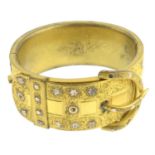 A 19th century gilt buckle bangle, with star motif.