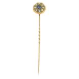 A late 19th century sapphire and split pearl stick pin.