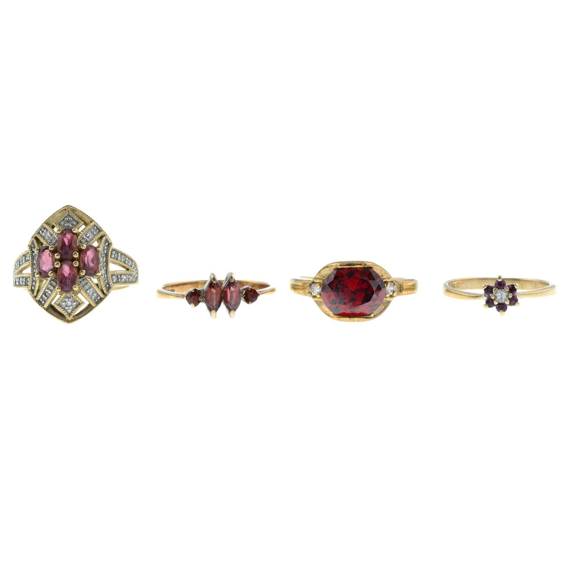 Four gem-set rings.