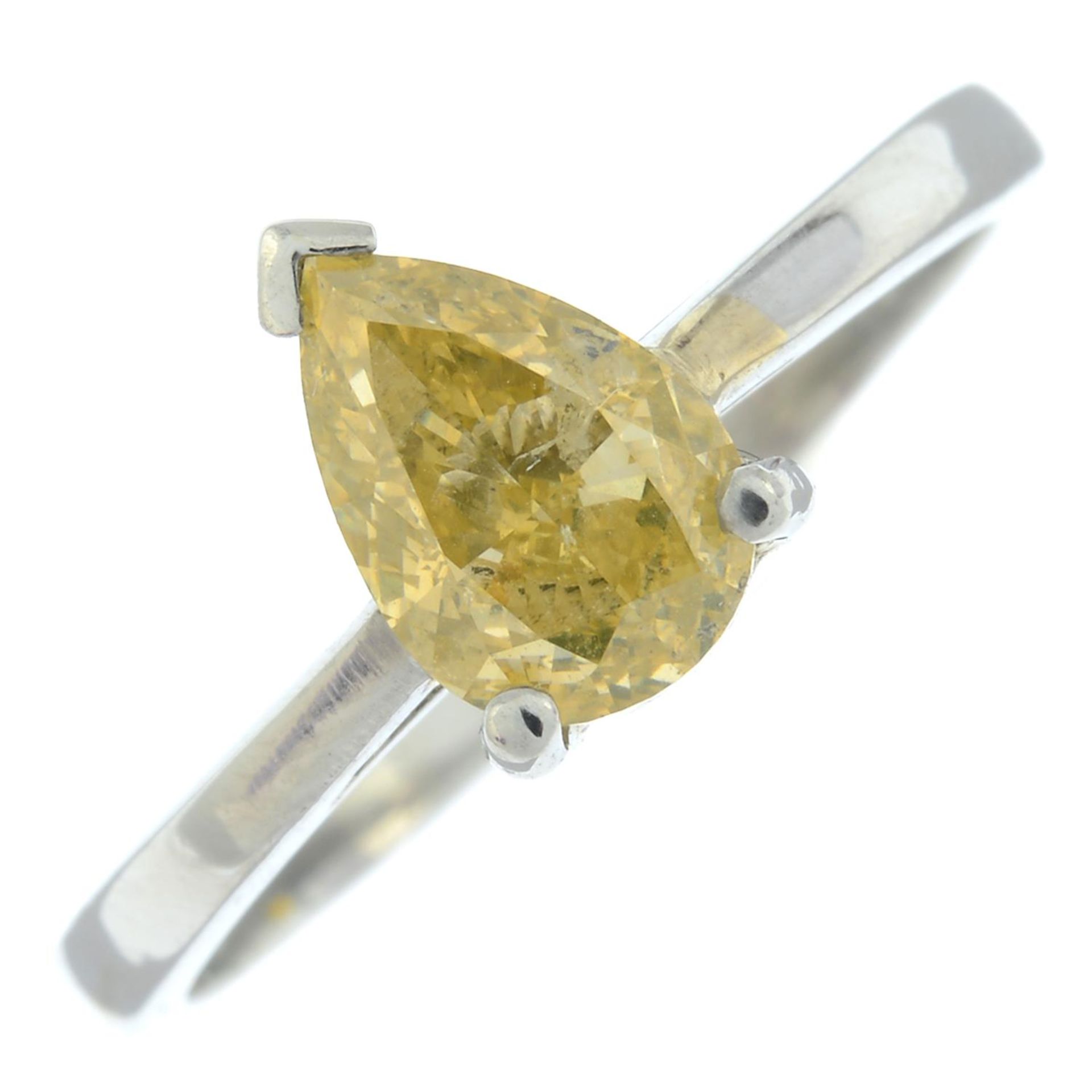 A platinum pear-shape 'yellow' diamond single-stone ring.