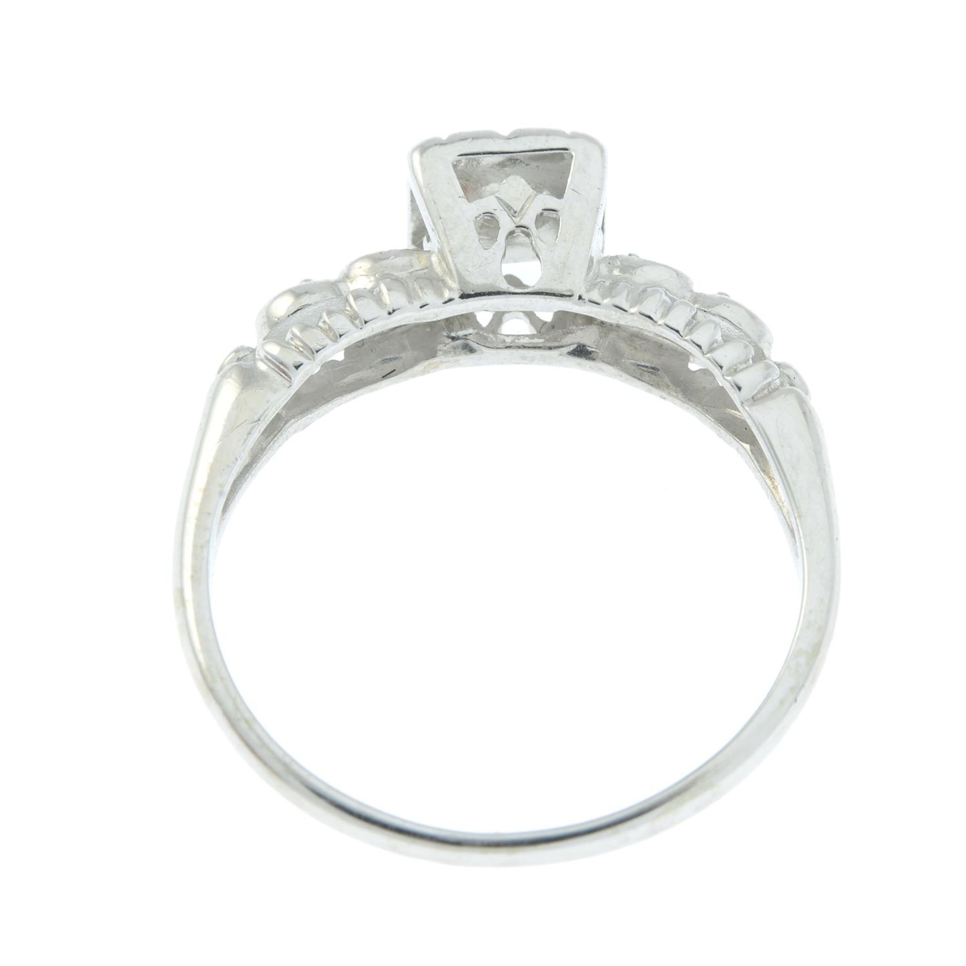 A brilliant-cut diamond single-stone ring, with diamond shoulders. - Image 2 of 2