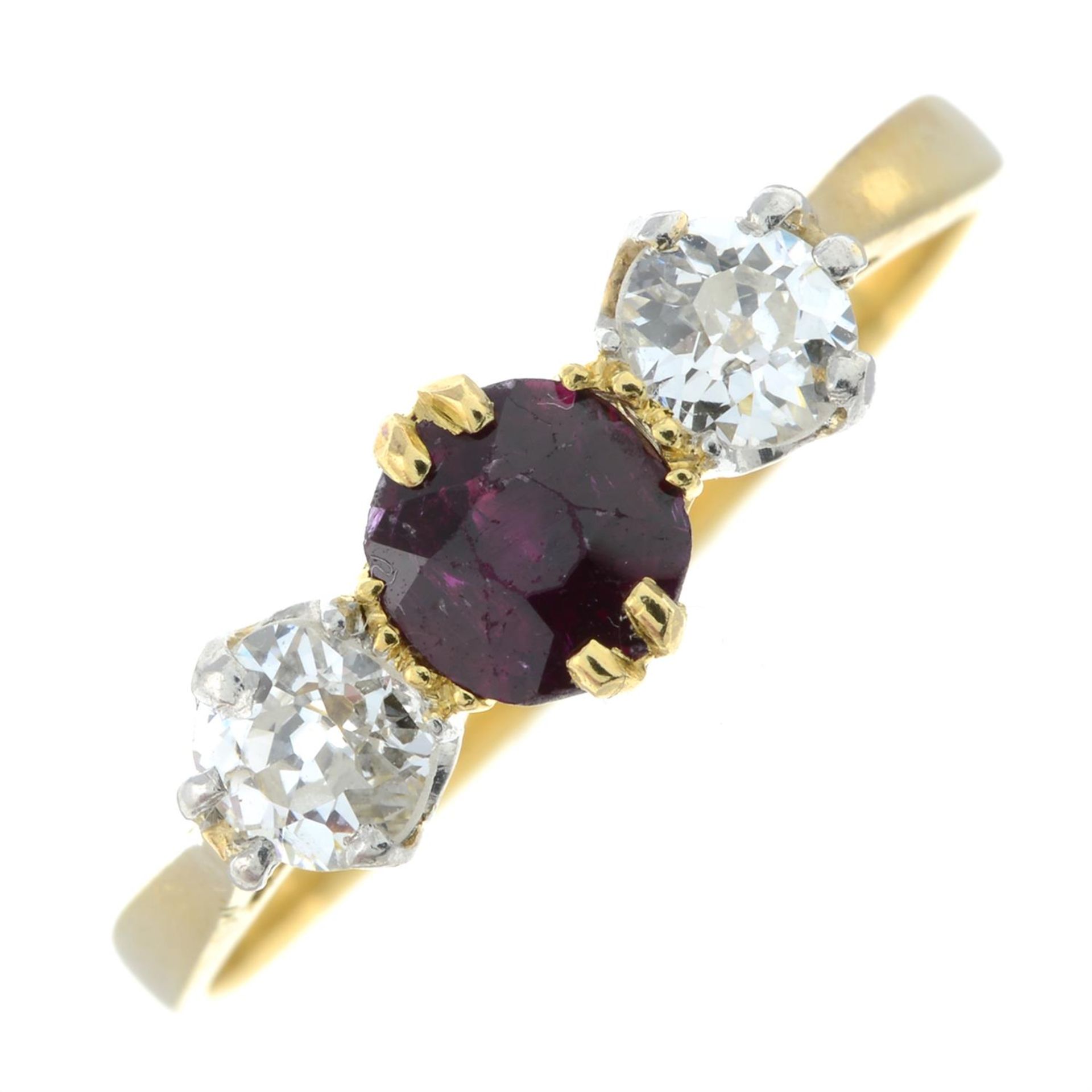 An early to mid 20th century 18ct gold ruby and old-cut diamond three-stone ring.
