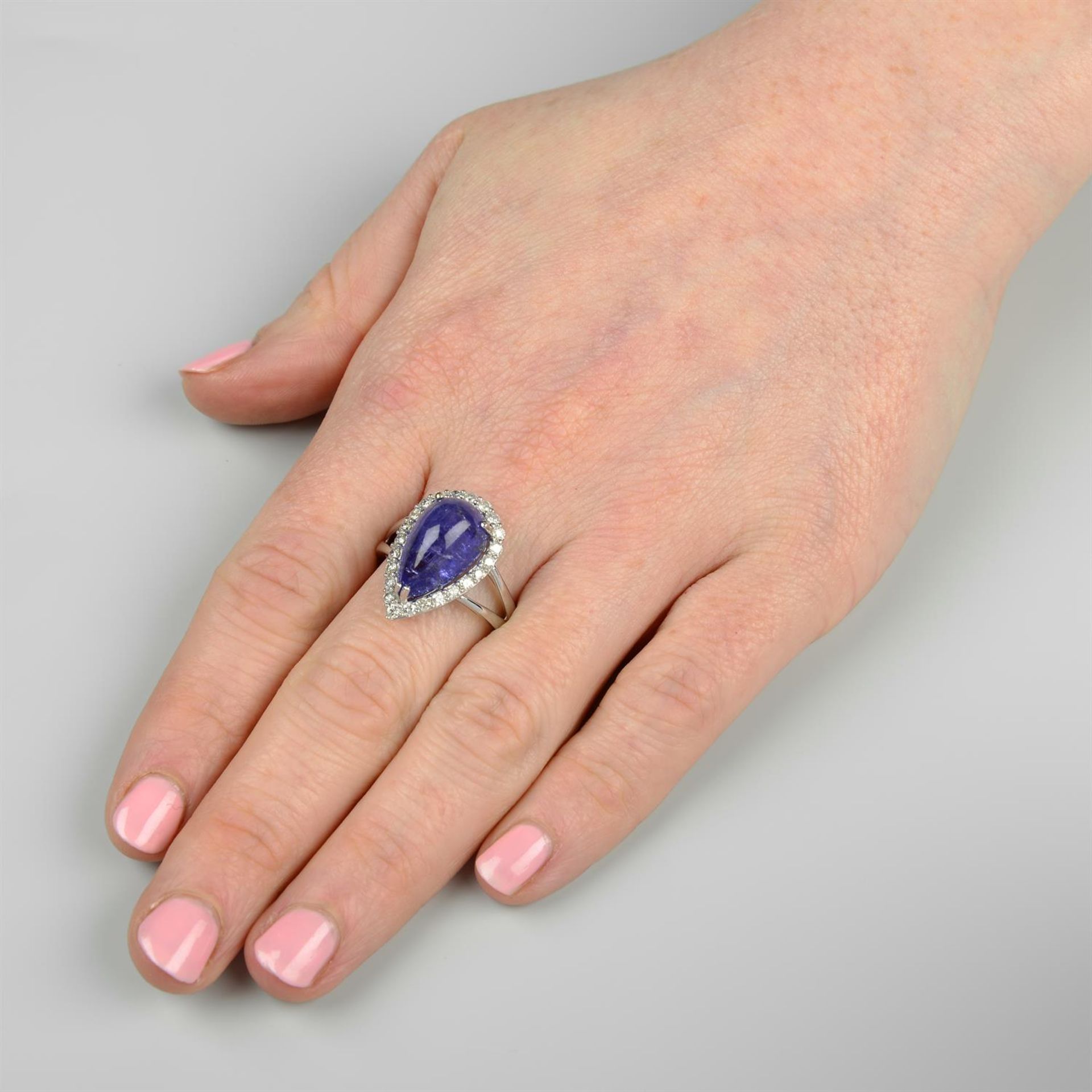 A tanzanite cabochon and diamond cluster ring. - Image 5 of 5