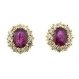 A pair of ruby and brilliant-cut diamond cluster earrings.